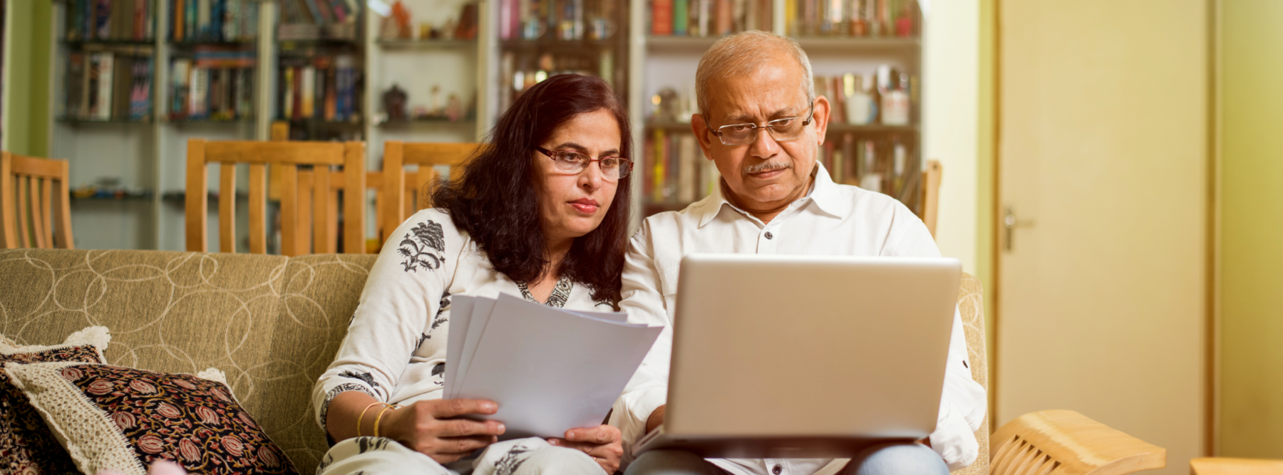 couple on couch watching online presentation