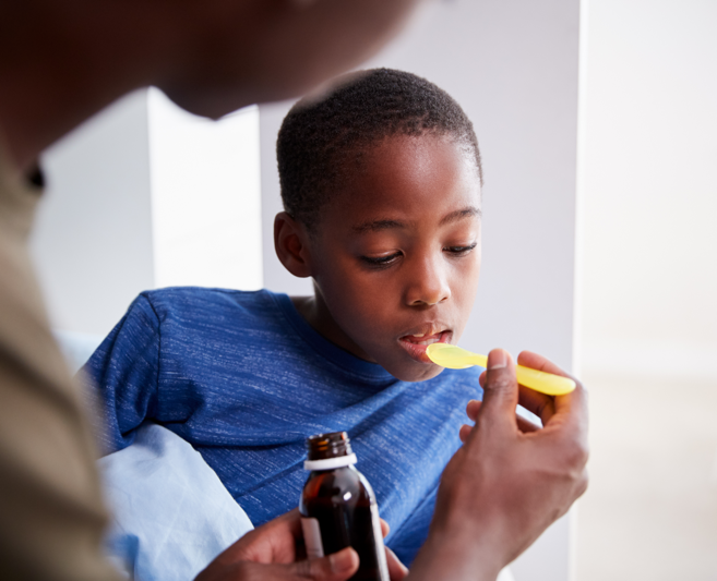 boy taking antibiotic